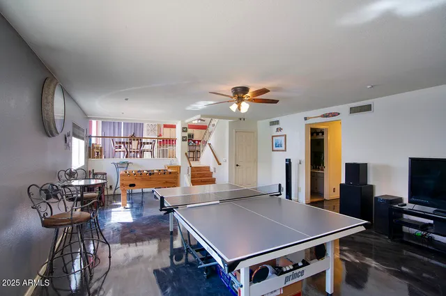 a very nice looking dining room with a large window
