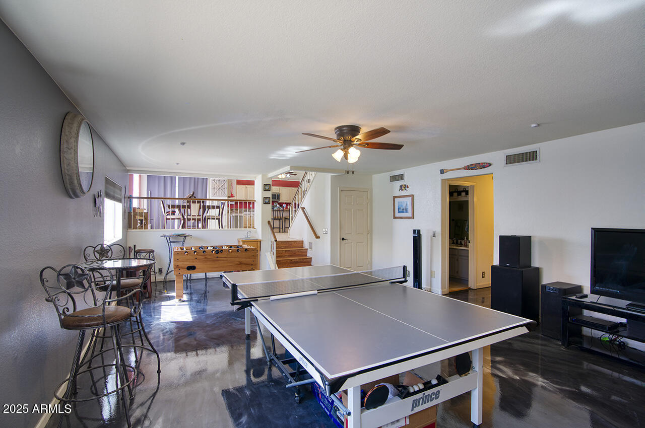 12677 North 77th Drive Peoria, AZ 85381 - Photo 9 of 25 a room with furniture pool table and flat screen tv