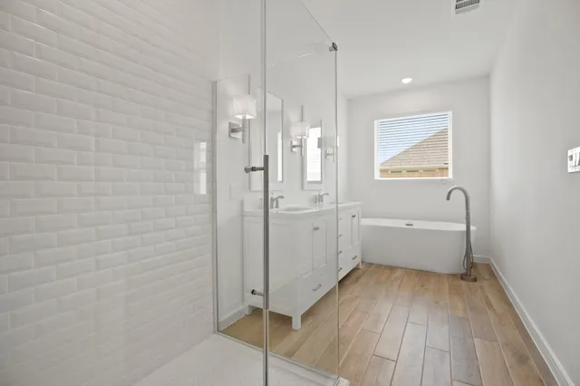 a bathroom with a bathtub and a shower