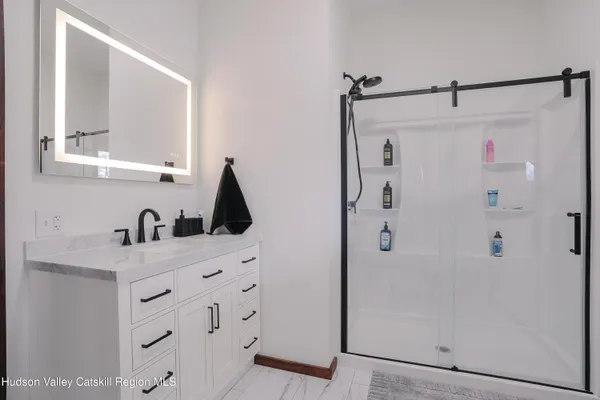 a view of a livingroom with furniture and a flat screen tv
