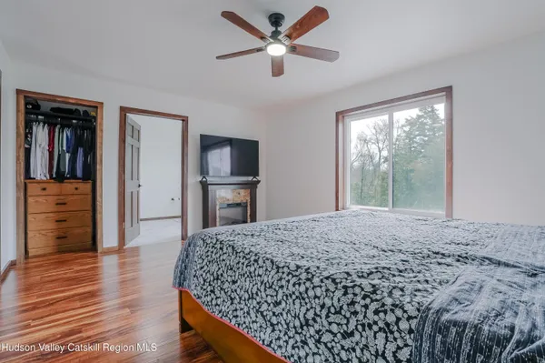 a bedroom with a bed and window