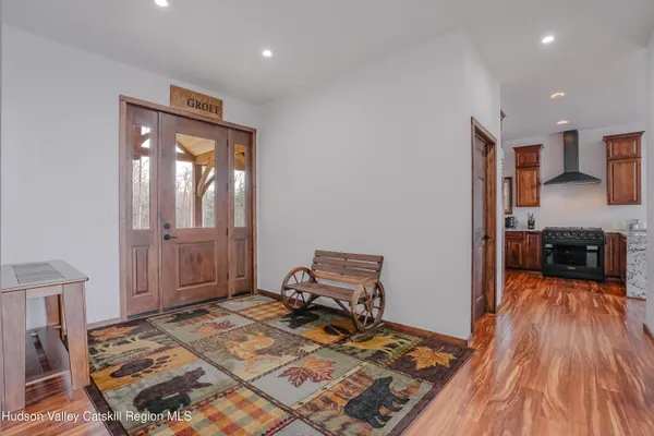 a bedroom with a bed and a mirror