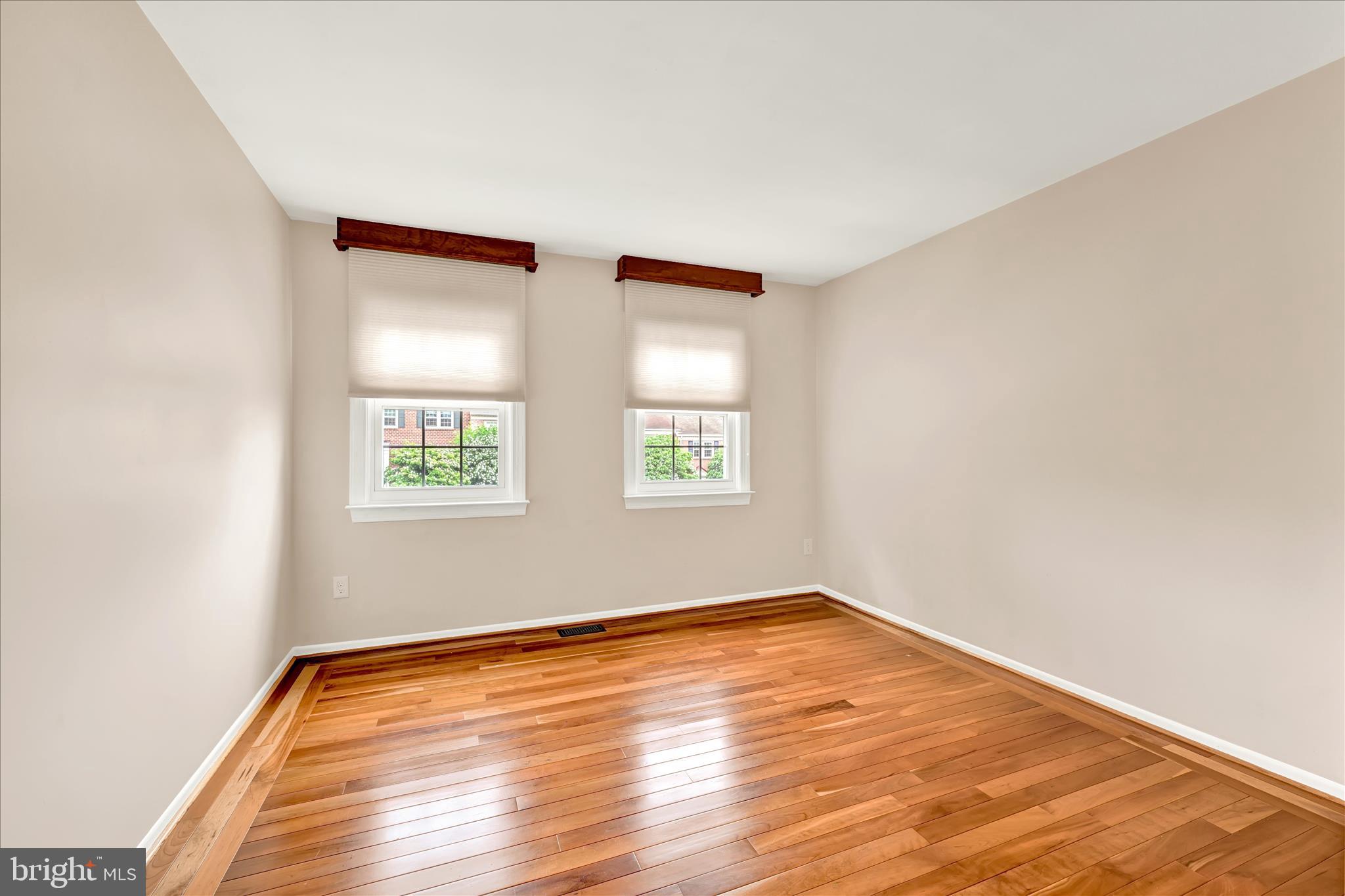 2317 Wonderview Road Lutherville-Timonium, MD 21093 - Photo 18 of 27 an empty room with wooden floor and windows