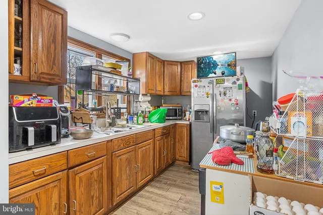 a kitchen with refrigerator and window