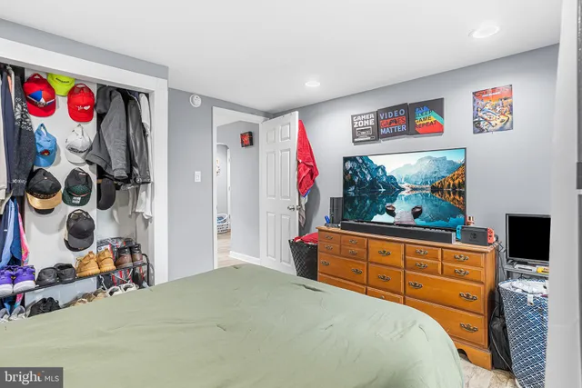 a bedroom with a bed and cabinets