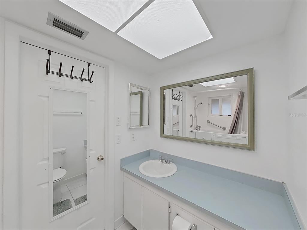 215 Valencia Boulevard, Unit 213 Largo, FL 33770 - Photo 17 of 21 a view of hallway with bathroom