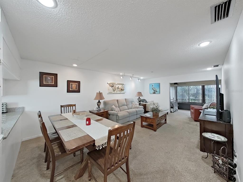 215 Valencia Boulevard, Unit 213 Largo, FL 33770 - Photo 10 of 21 a view of a dining room with furniture
