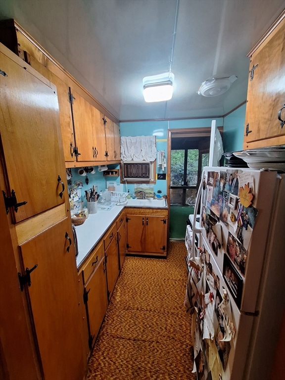 14 Mahkeenac Road Stockbridge, MA 01262 - Photo 8 of 28 a kitchen with stainless steel appliances a sink a stove a refrigerator and cabinets