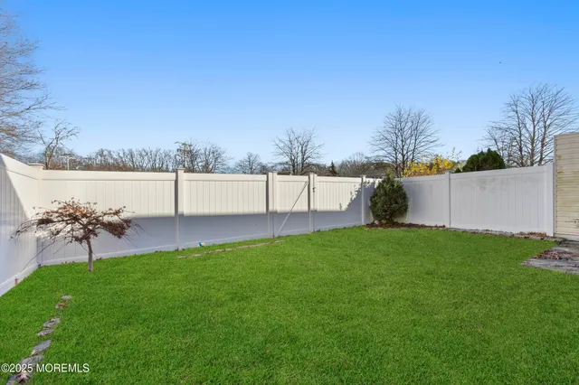 a view of a garden with an outdoor seating