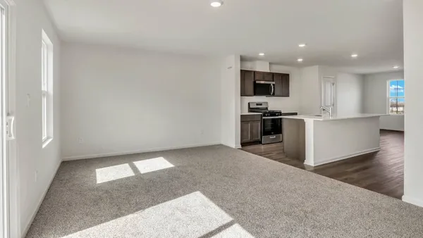 a view of a kitchen with a sink and stainless steel appliances