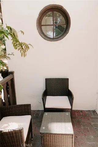 a view of a livingroom with furniture and window