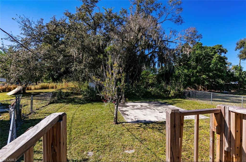 318 Bellair Road Fort Myers, FL 33905 - Photo 17 of 29 a view of a swimming pool with a patio and a yard
