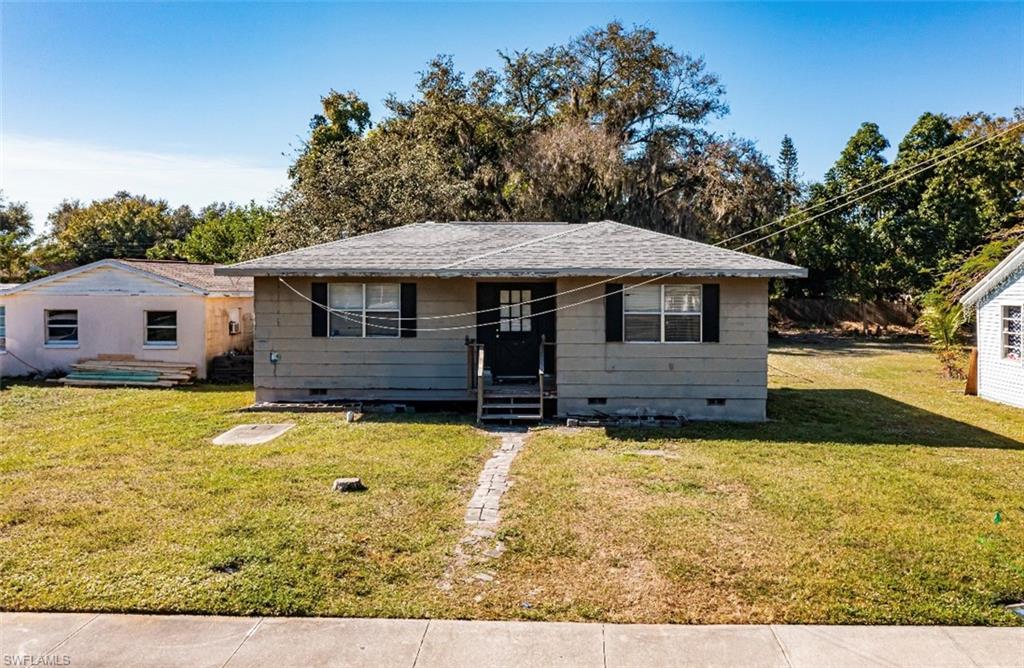 318 Bellair Road Fort Myers, FL 33905 - Photo 23 of 29 a view of a house with a yard