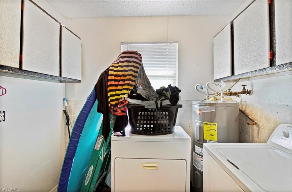 318 Bellair Road Fort Myers, FL 33905 - Photo 29 of 29 a utility room with dryer and washer
