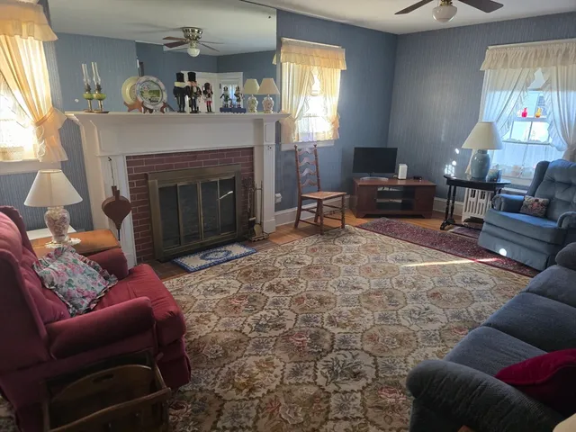 a living room with furniture and a fireplace