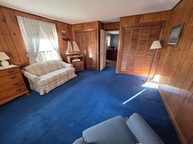 a bedroom with furniture and a window