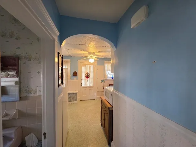 a view of a room with a hallway