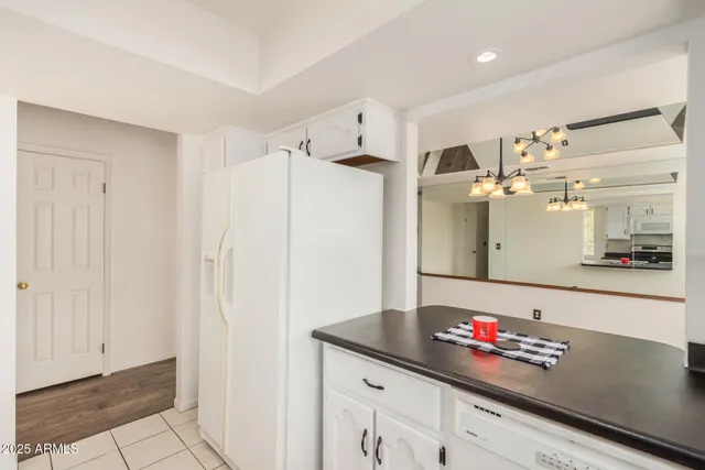 a view of a big room with wooden floor closet and windows