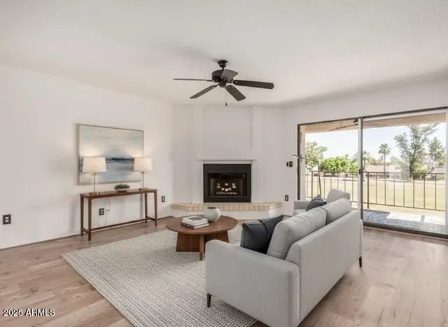 a living room with furniture and a fireplace