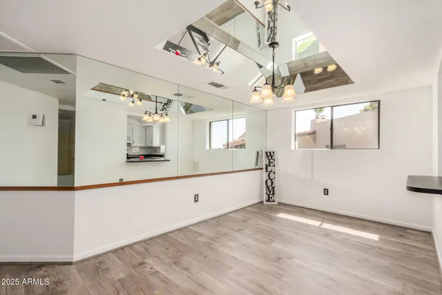 a view large windows and chandelier