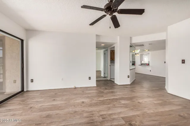 a view of a kitchen with a sink dishwasher a stove top oven a counter space and cabinets