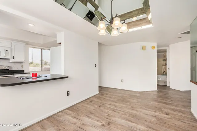 a kitchen with stainless steel appliances a sink stove and refrigerator