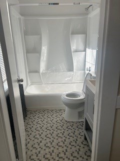 89 Broadway, Unit 3 Quincy, MA 02169 - Photo 2 of 3 a bathroom with a toilet and a shower