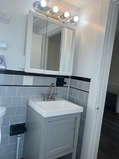 89 Broadway, Unit 3 Quincy, MA 02169 - Photo 3 of 3 a bathroom with a sink and a mirror