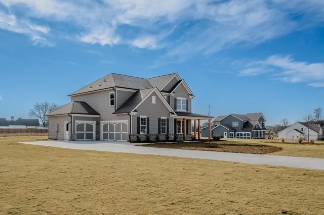 a front view of a house with swimming pool