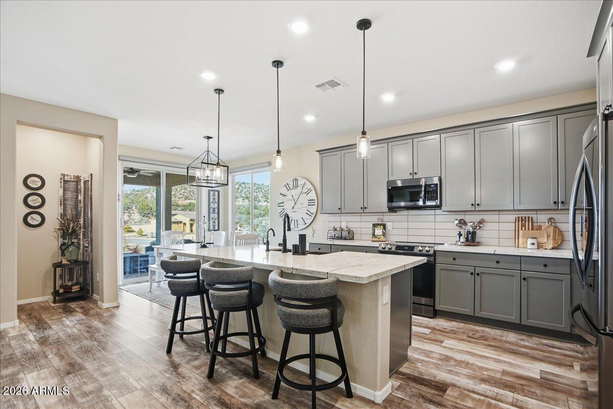 6150 North Stratford Court Rimrock, AZ 86335 - Photo 17 of 60 a kitchen with lots of counter space a sink and appliances