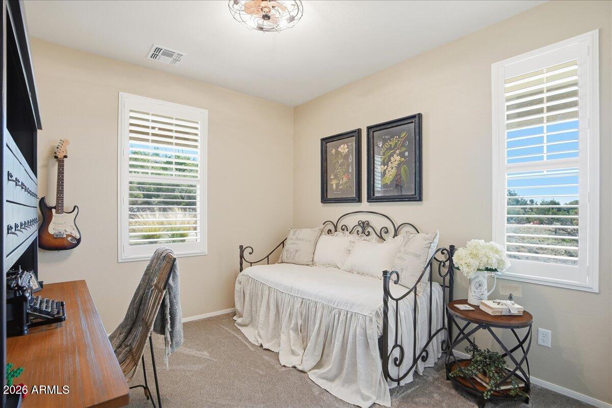 6150 North Stratford Court Rimrock, AZ 86335 - Photo 32 of 60 a bedroom with a bed and a desk