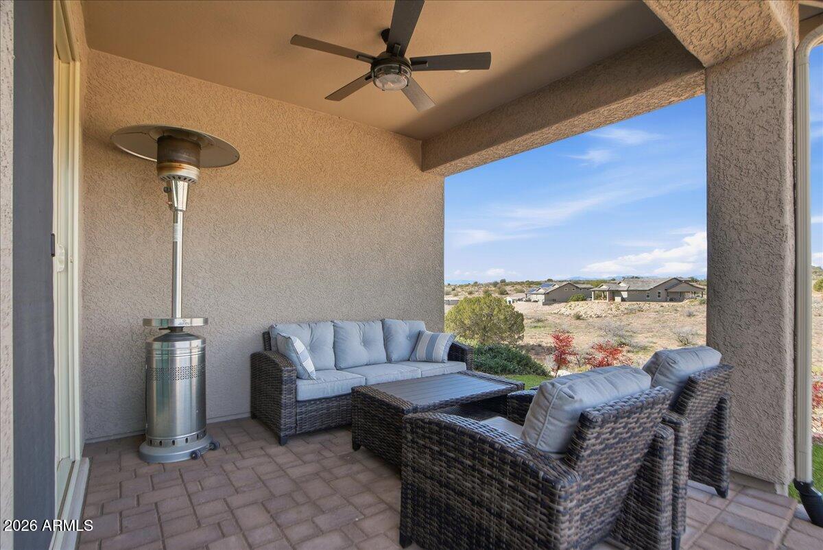 6150 North Stratford Court Rimrock, AZ 86335 - Photo 40 of 60 a living room with furniture and a floor to ceiling window