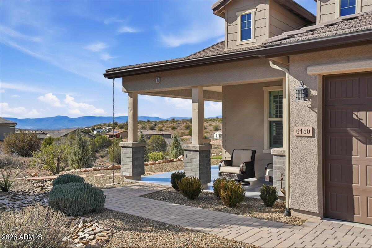 6150 North Stratford Court Rimrock, AZ 86335 - Photo 8 of 60 a view of a balcony with couch and wooden floor