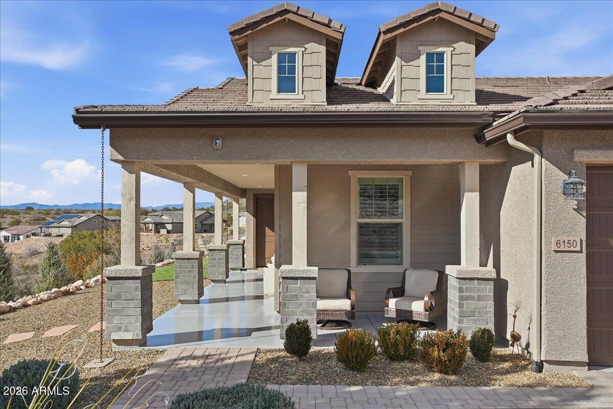 6150 North Stratford Court Rimrock, AZ 86335 - Photo 9 of 60 a front view of a house with glass windows