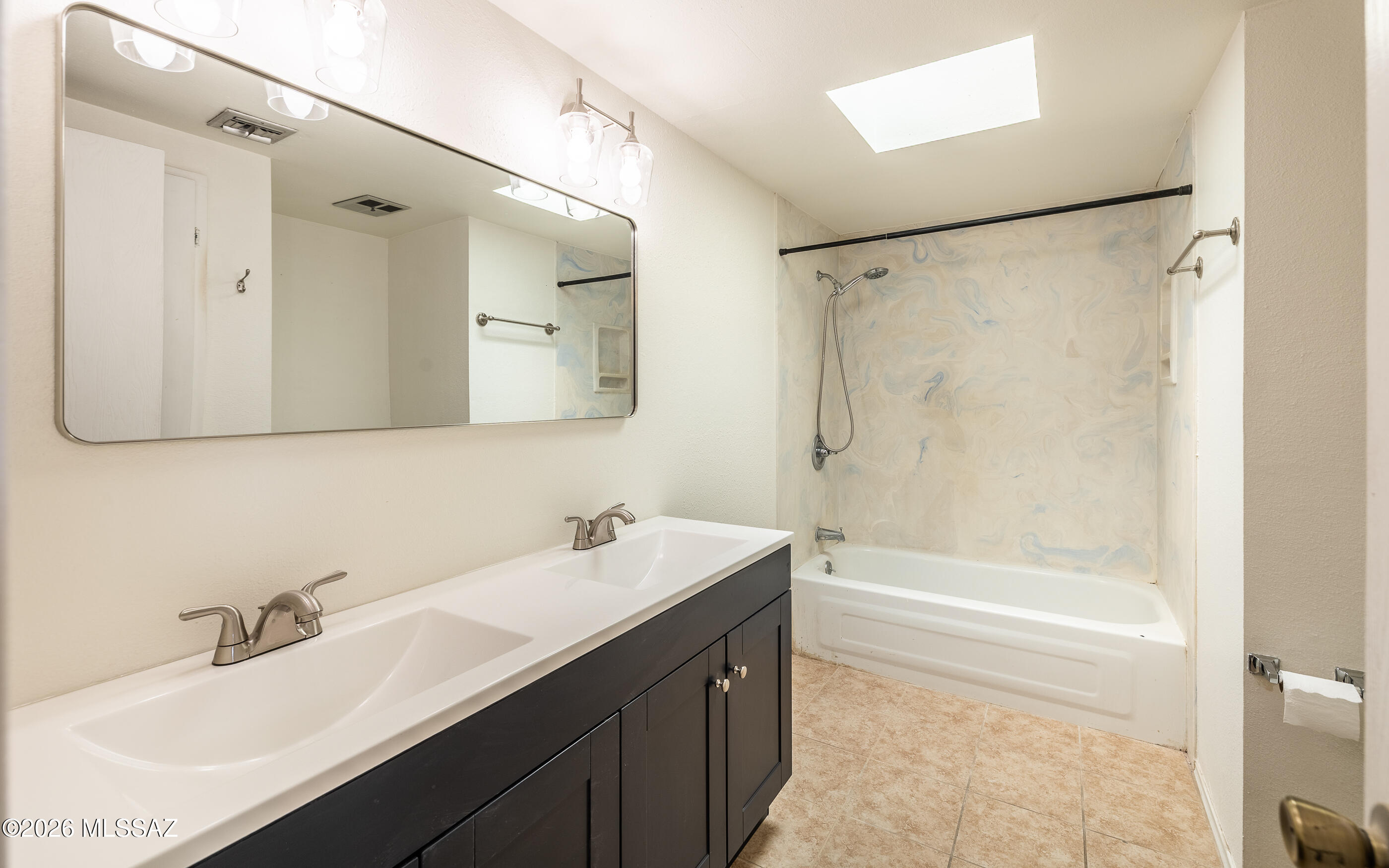 3750 North Country Club Road, Unit 46 Tucson, AZ 85716 - Photo 29 of 34 a bathroom with a tub sink shower and mirror
