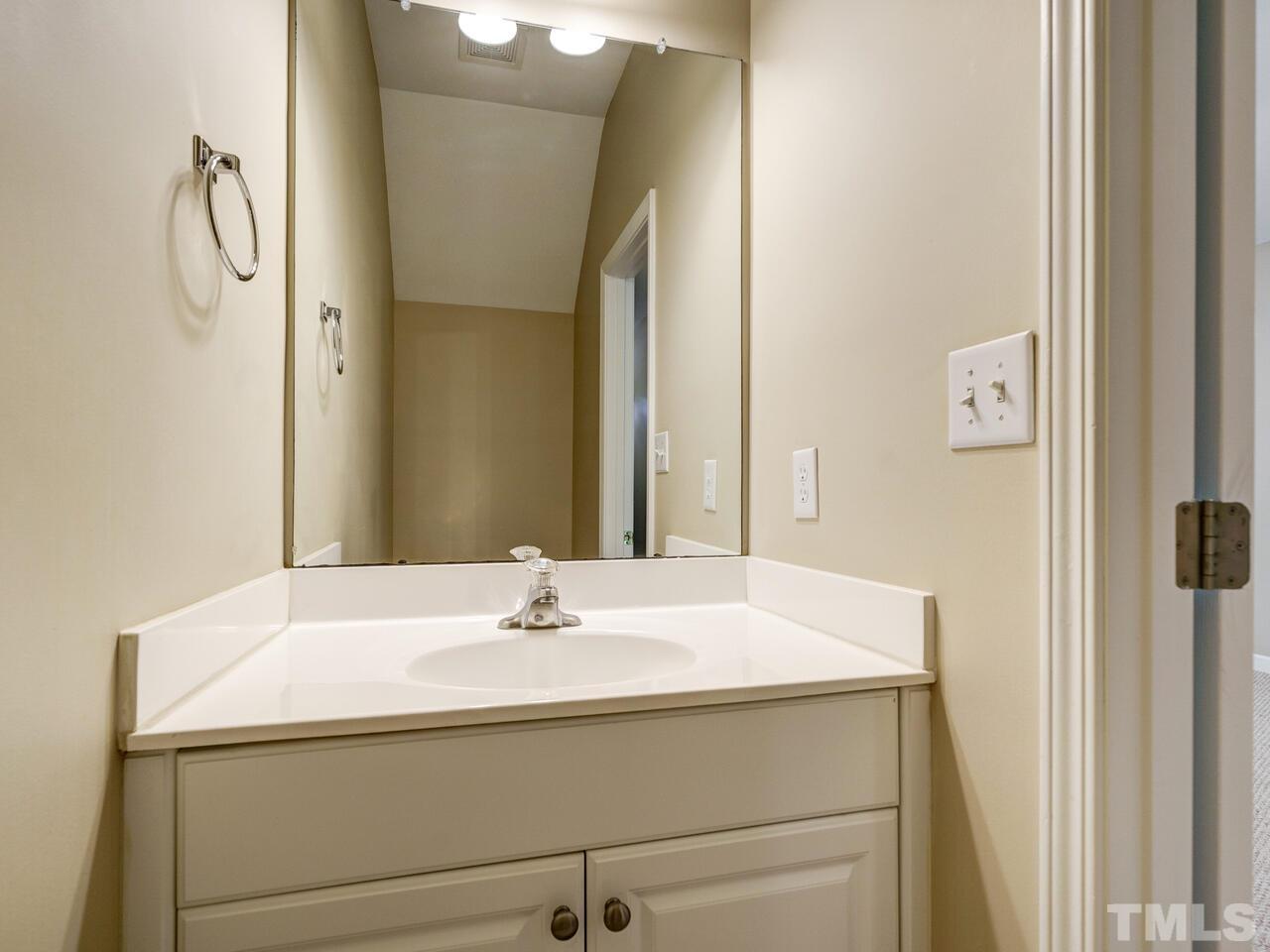 844 Horton Road, Unit 40 Durham, NC 27704 - Photo 8 of 19 a bathroom with a sink and a mirror