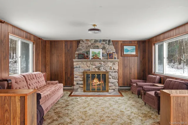 a living room with furniture and a fireplace