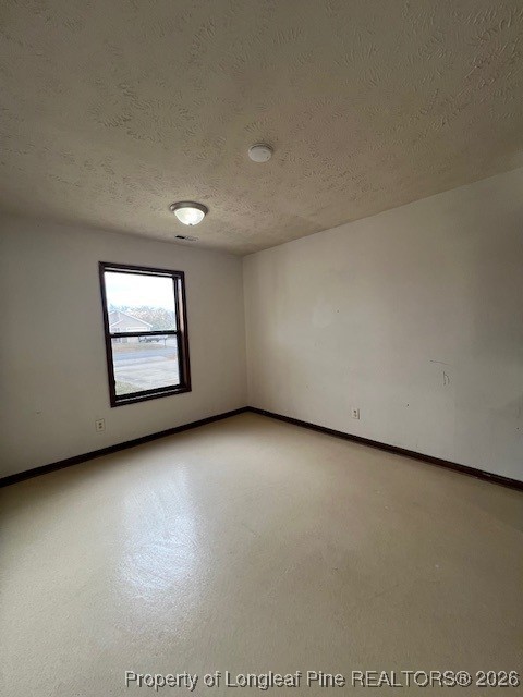 164 Eulon Loop, Unit A & B Raeford, NC 28376 - Photo 4 of 12 an empty room with windows