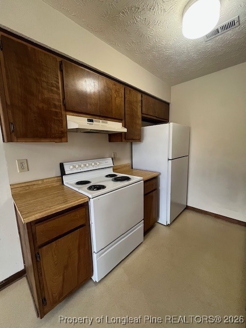164 Eulon Loop, Unit A & B Raeford, NC 28376 - Photo 6 of 12 a kitchen with stainless steel appliances granite countertop a stove a refrigerator and a microwave