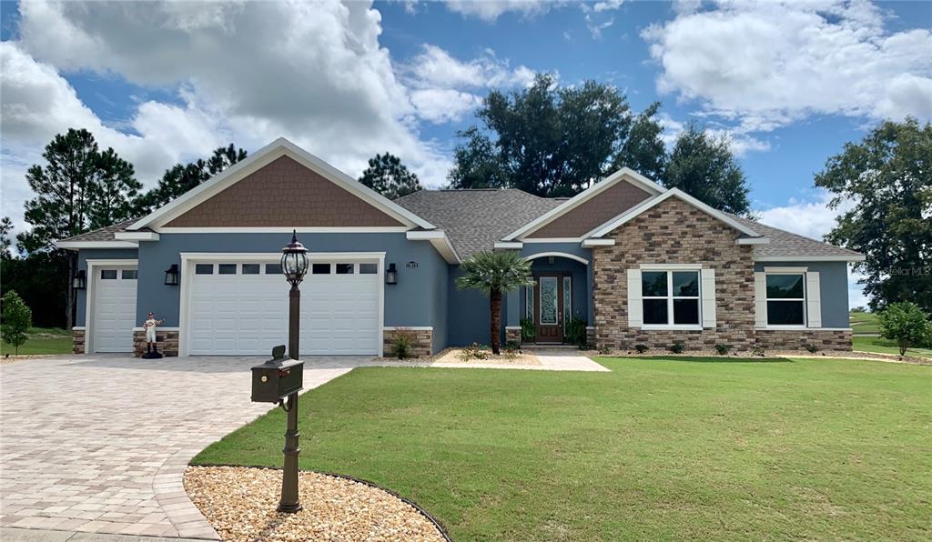 17872 Southwest 72 Street Road Dunnellon, FL 34432 - Photo 1 of 1 a front view of a house with garden