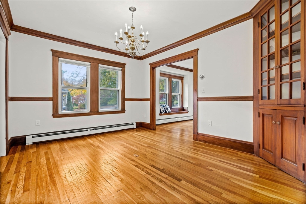 24 Vaille Avenue Lexington, MA 02421 - Photo 12 of 41 a view of an empty room with window and wooden floor