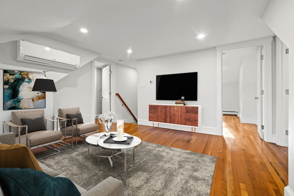 24 Vaille Avenue Lexington, MA 02421 - Photo 23 of 41 a living room with furniture and a flat screen tv
