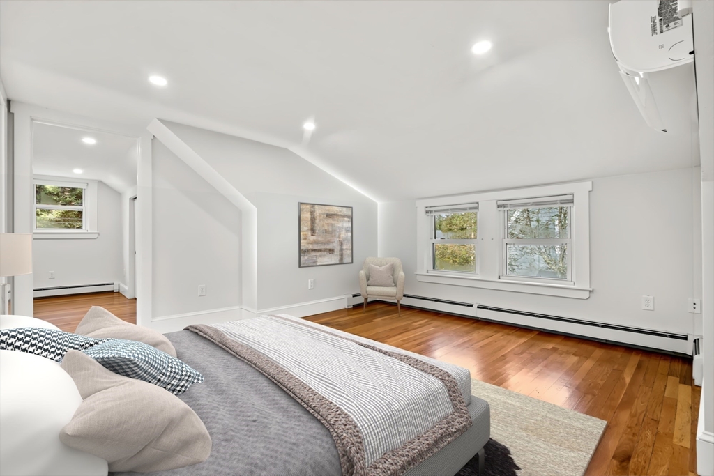 24 Vaille Avenue Lexington, MA 02421 - Photo 24 of 41 a bedroom with a bed and a large window