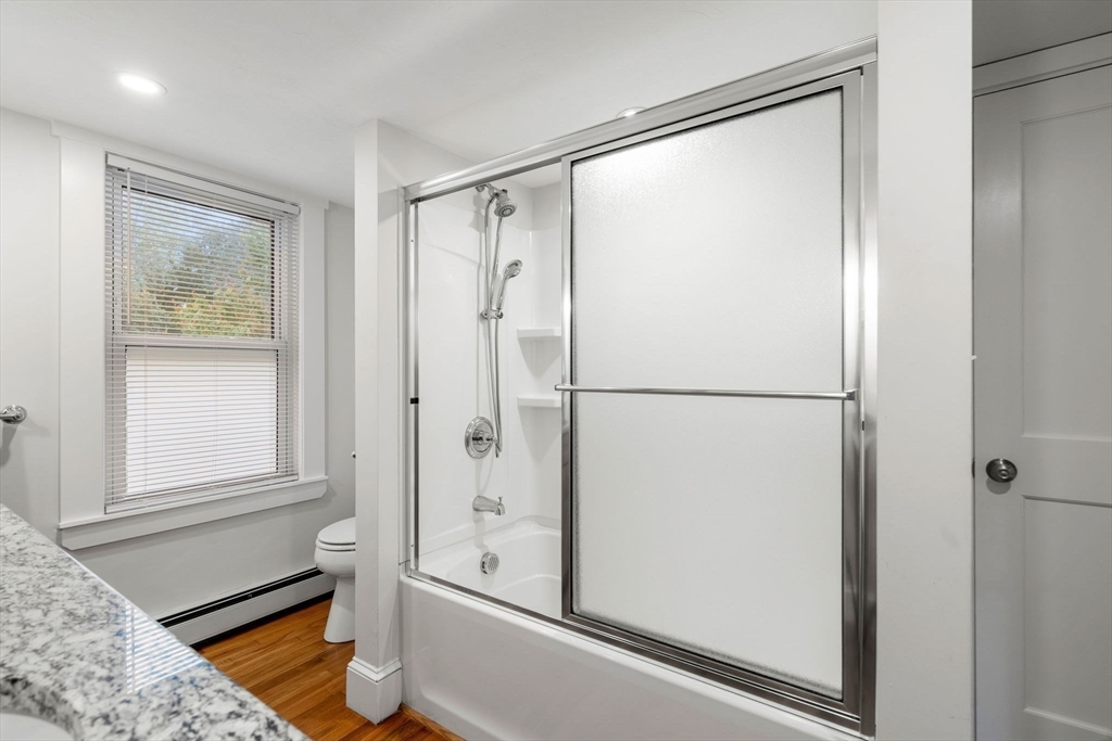 24 Vaille Avenue Lexington, MA 02421 - Photo 27 of 41 a bathroom with a tub and shower