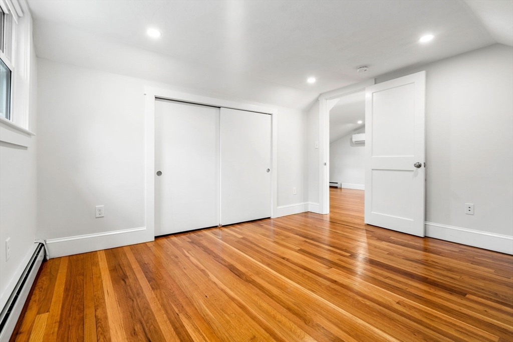 24 Vaille Avenue Lexington, MA 02421 - Photo 30 of 41 a view of empty room with wooden floor