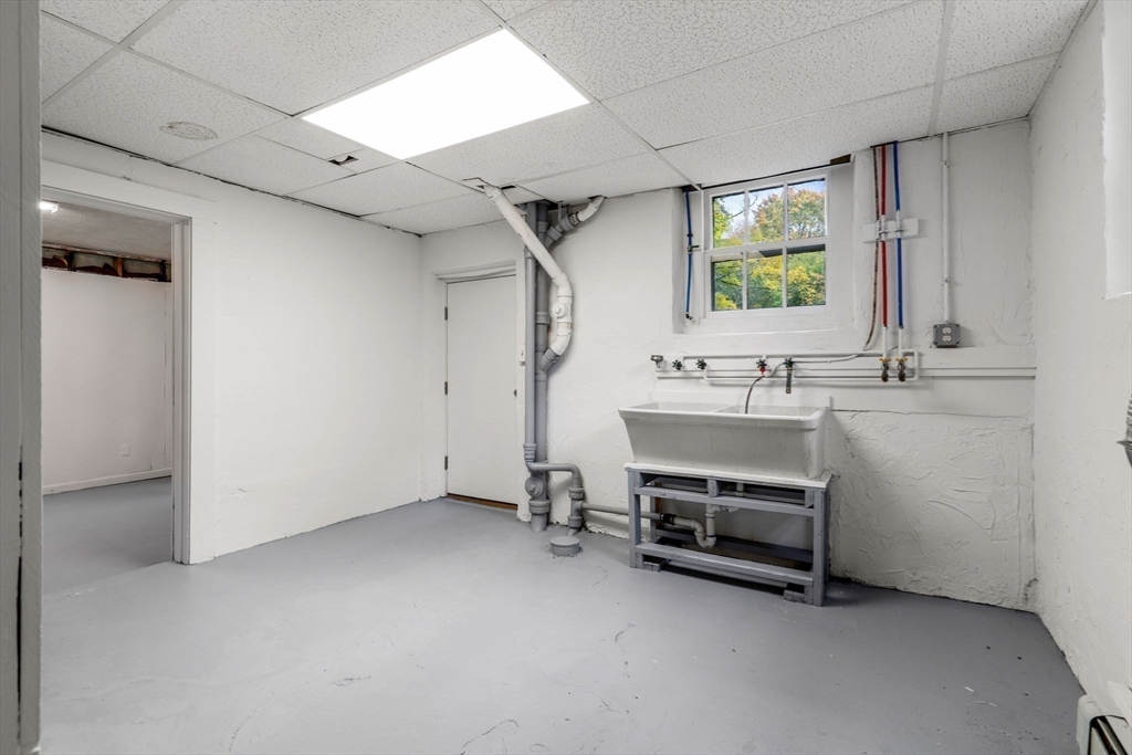 24 Vaille Avenue Lexington, MA 02421 - Photo 35 of 41 a bathroom with a sink and a mirror