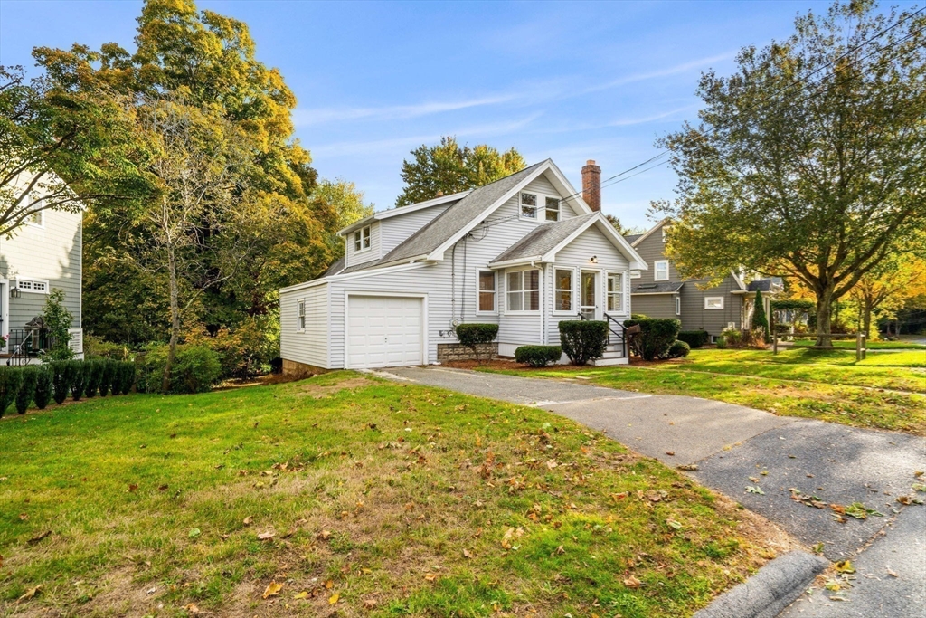 24 Vaille Avenue Lexington, MA 02421 - Photo 38 of 41 a front view of a house with a yard and trees