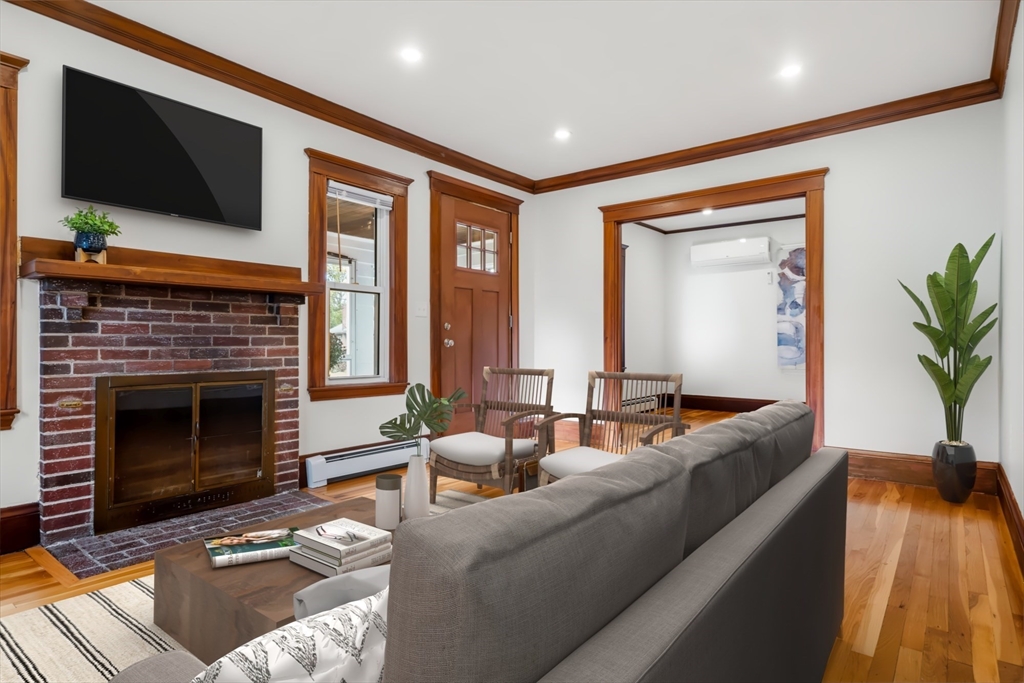 24 Vaille Avenue Lexington, MA 02421 - Photo 8 of 41 a living room with furniture fireplace and flat screen tv