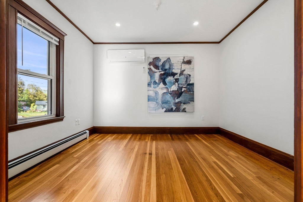 24 Vaille Avenue Lexington, MA 02421 - Photo 9 of 41 a view of empty room with window and wooden floor