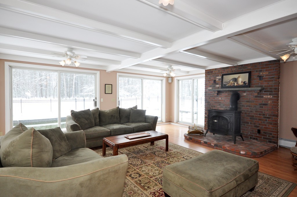 33 Warner Road Bolton, MA 01740 - Photo 4 of 23 a living room with fireplace furniture and a fireplace
